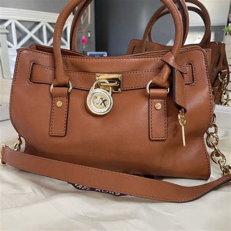 michael kors handbag with lock.